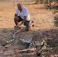 Guests with cheetah at Lion and Cheetah Sanctuary – Joxilox October 2024