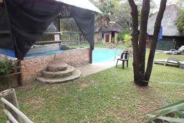 Log cabin exterior at OUMA naturist bush camp