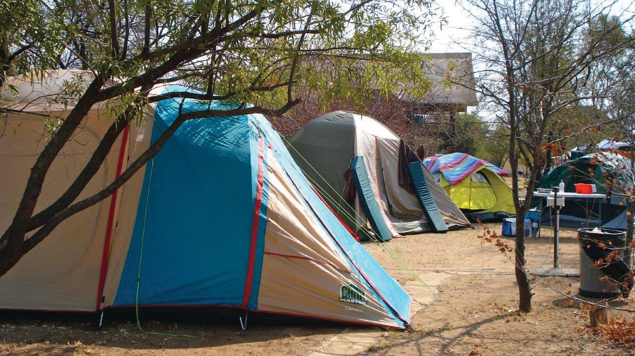 Safari tent glamping accommodation at SunEden Naturist Resort