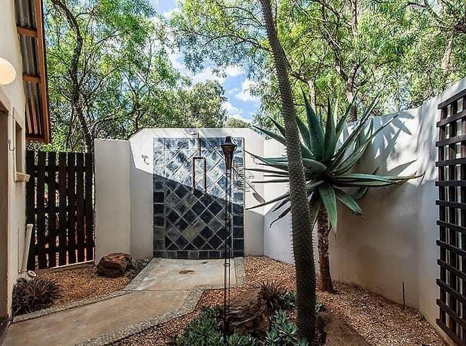 Courtyard and outdoor shower at Feathered Nest Guest Farm