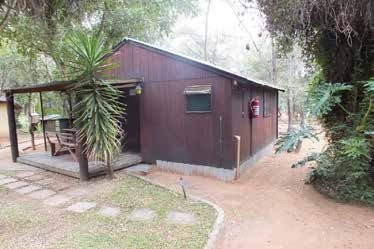 Wooden log cabin exterior at Lauma Aurora OUMA