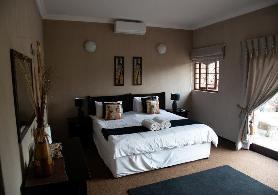 Deluxe unit bedroom at Desnudo Naturist Resort