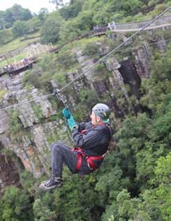 Guest on the zip line at Graskop Gorge – Joxilox NW Mpumalanga Tour 2023