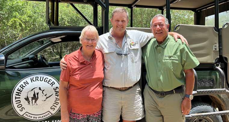 Guests with safari guide at Southern Kruger Safaris vehicle